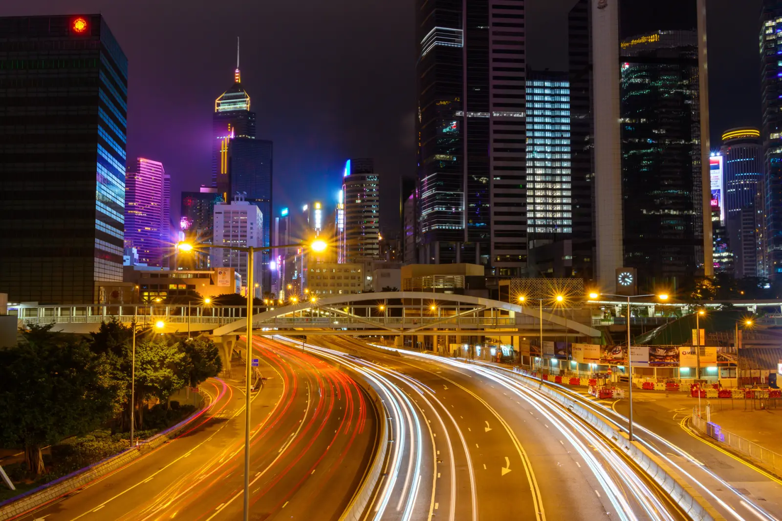 Hong Kong street at night with vehicle light trails