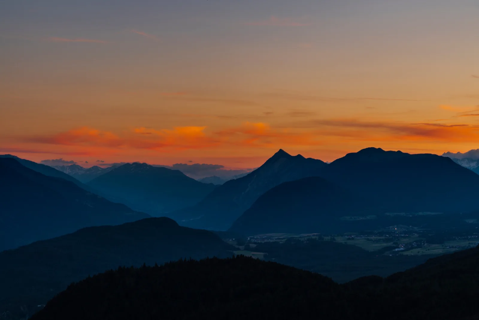 Layered mountain ridges at dusk on the Austrian and German border